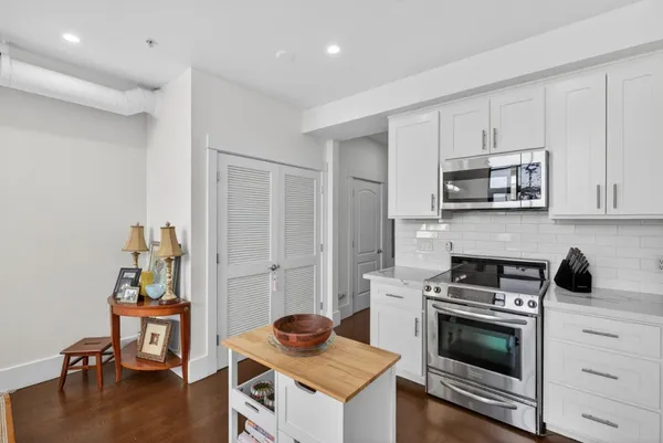 a kitchen with a stove and a microwave
