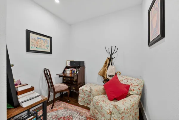 a living room with furniture and a chair