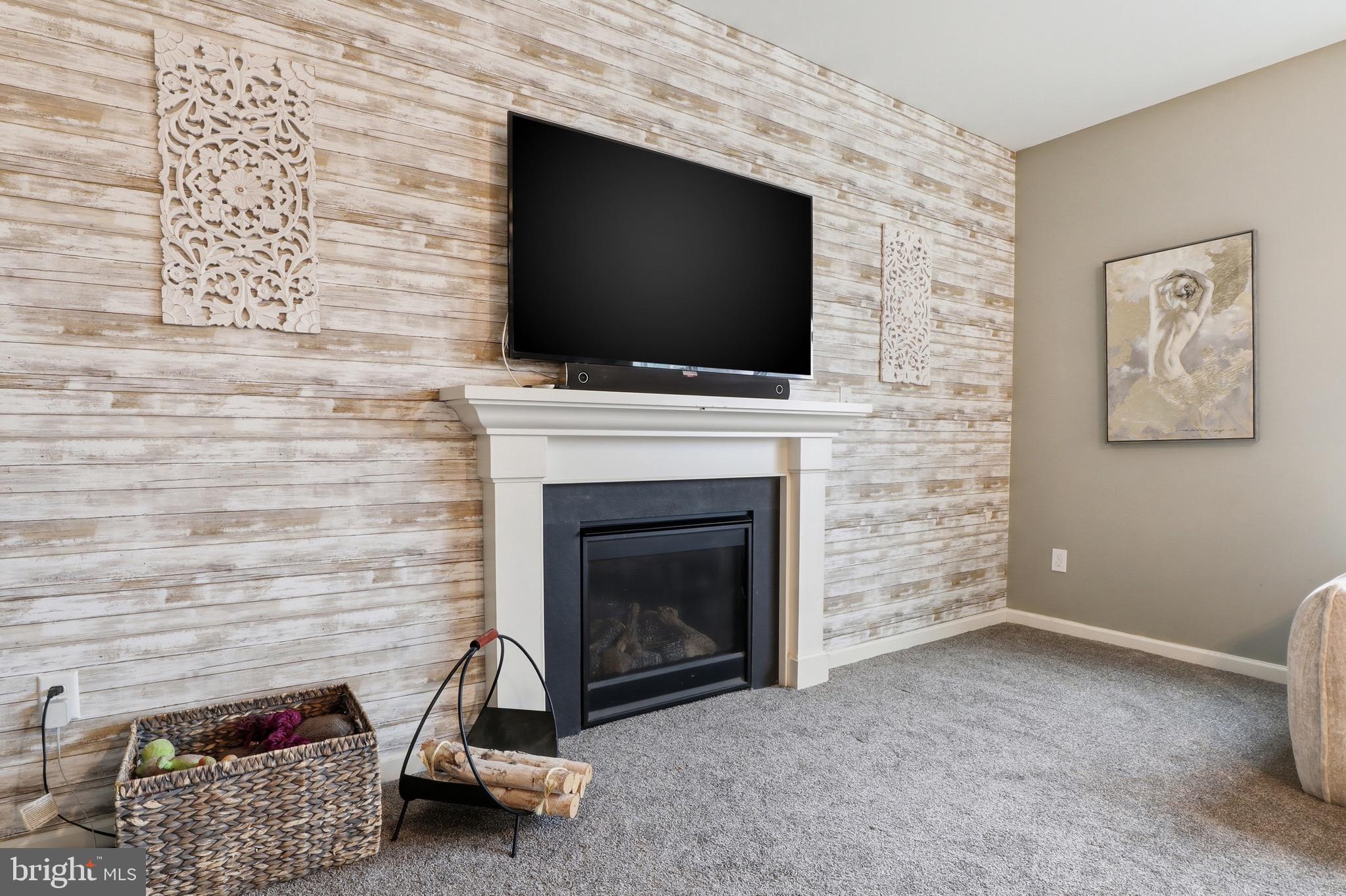 215 Azalea Drive Windsor, PA 17366 - Photo 12 of 68 a living room with a fireplace and a flat screen tv