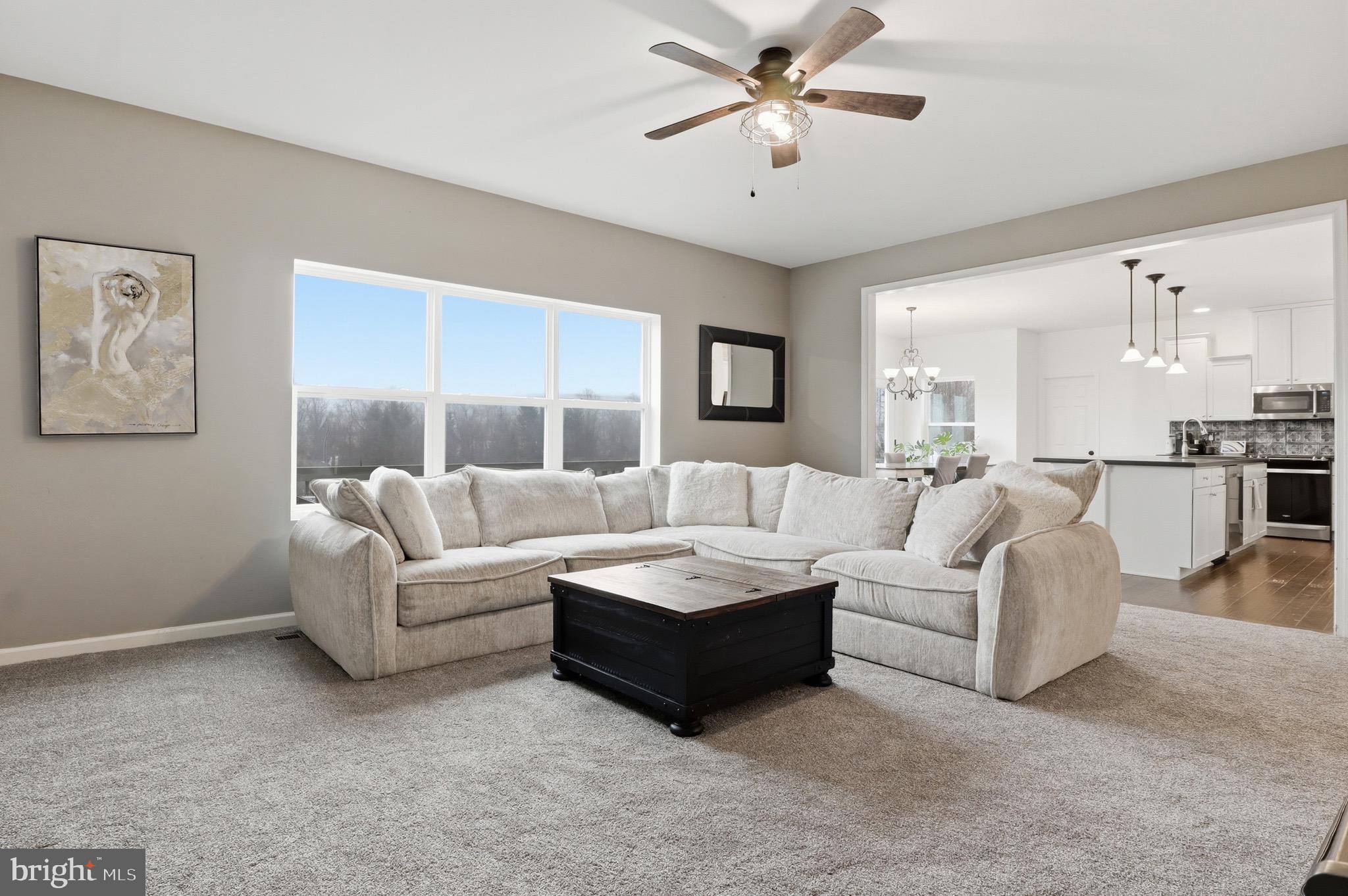 215 Azalea Drive Windsor, PA 17366 - Photo 13 of 68 a living room with furniture and a chandelier