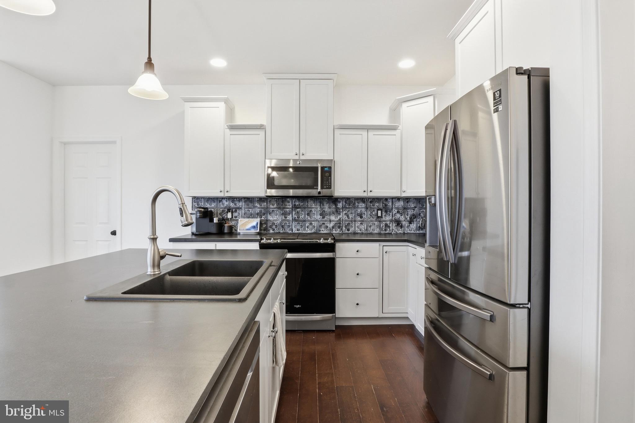 215 Azalea Drive Windsor, PA 17366 - Photo 15 of 68 a kitchen with stainless steel appliances a refrigerator sink and microwave