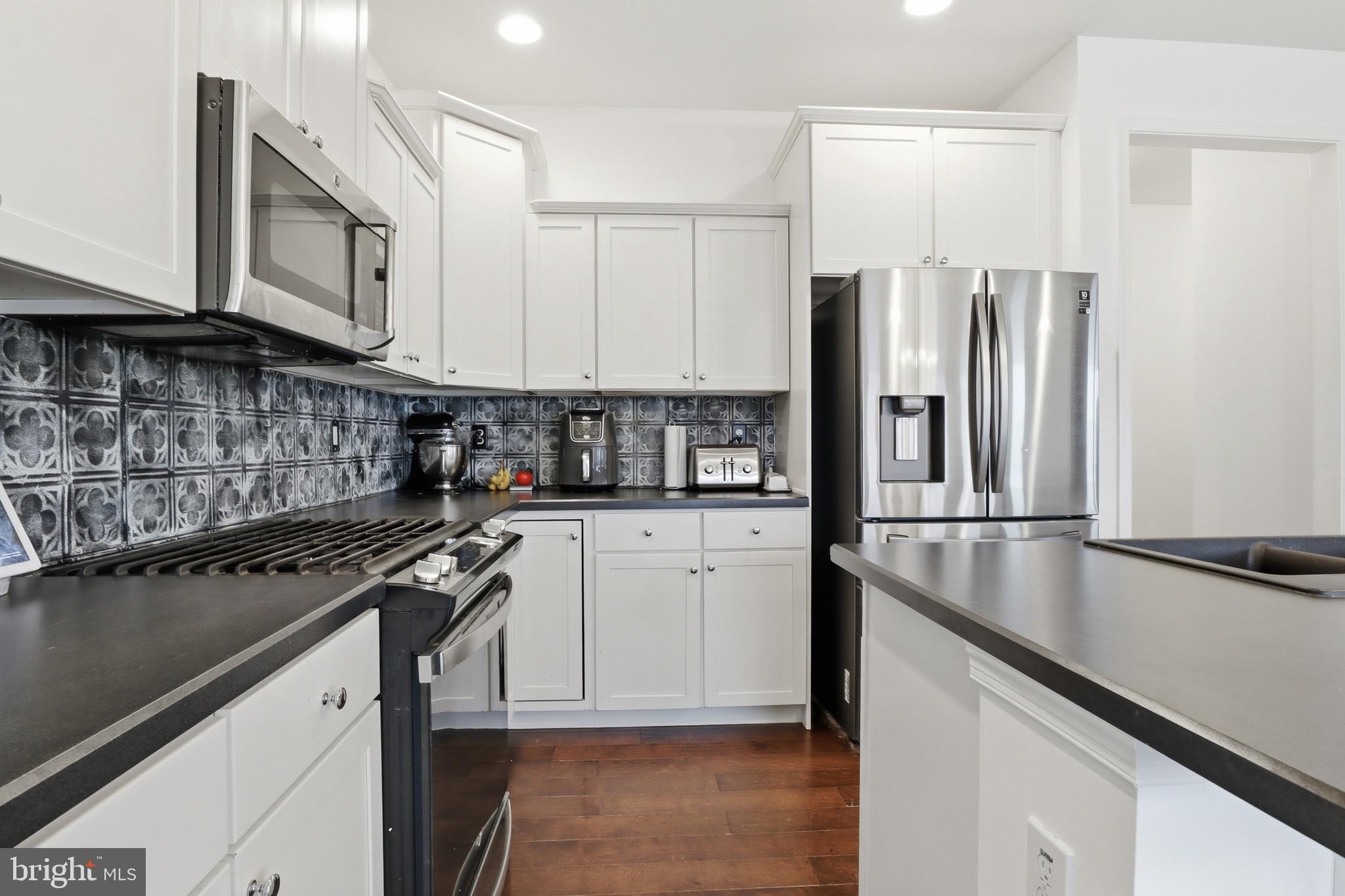215 Azalea Drive Windsor, PA 17366 - Photo 16 of 68 a kitchen with stainless steel appliances granite countertop a refrigerator a stove and a sink