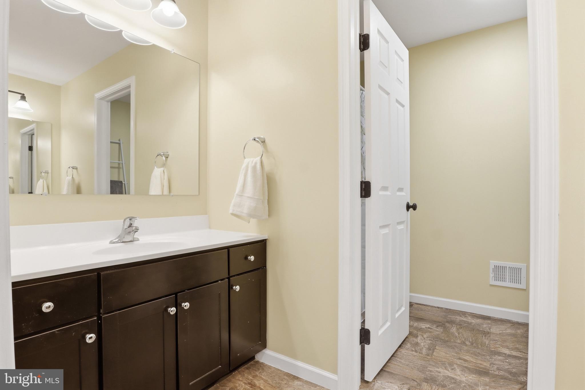215 Azalea Drive Windsor, PA 17366 - Photo 27 of 68 a bathroom with a double vanity sink and mirror