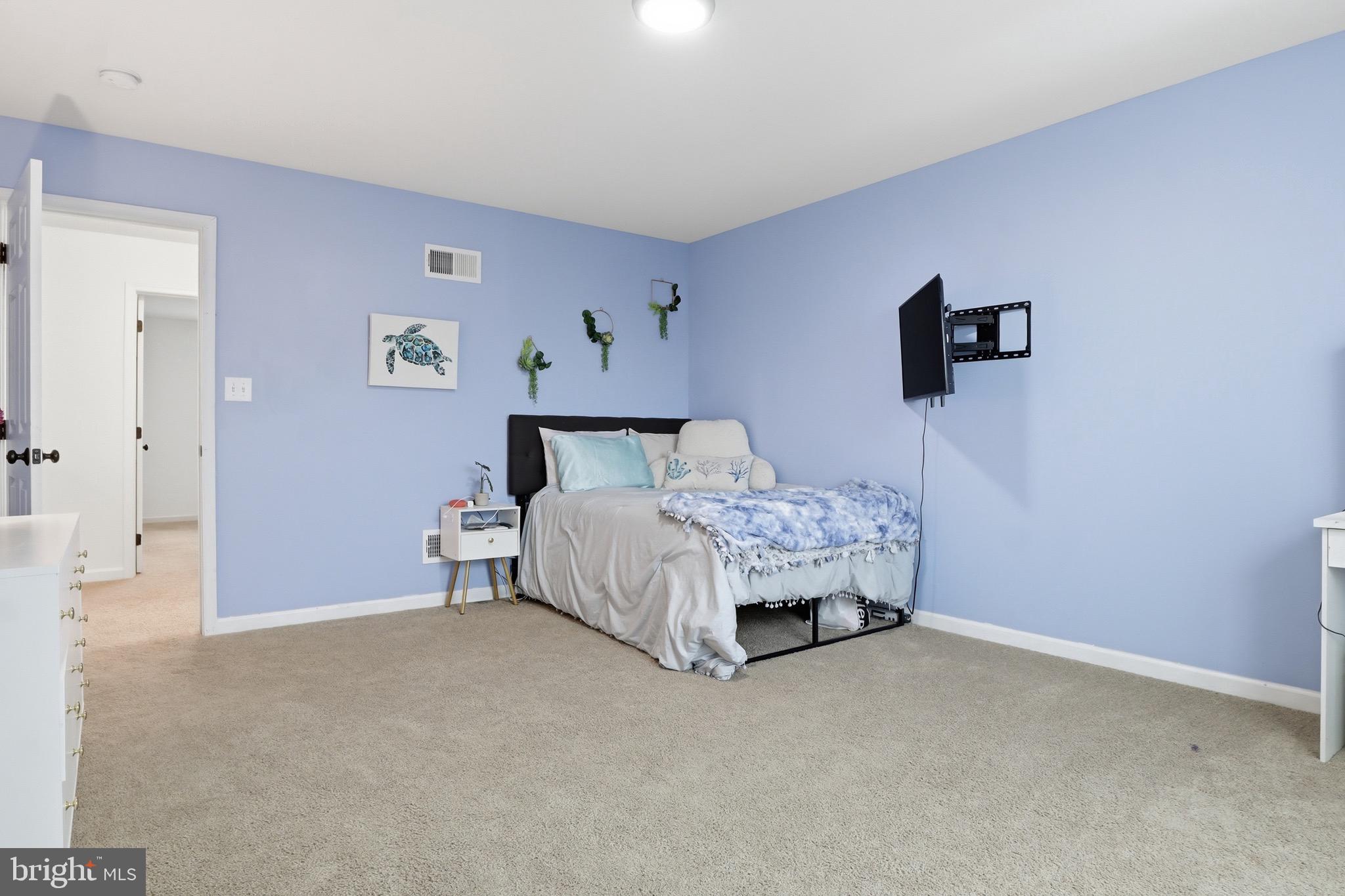 215 Azalea Drive Windsor, PA 17366 - Photo 30 of 68 a bedroom with a bed and a wall painting