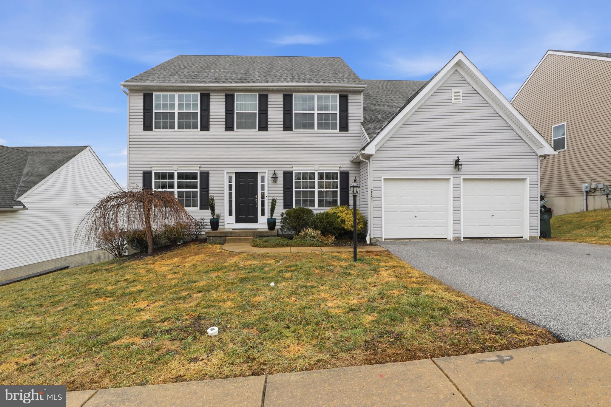215 Azalea Drive Windsor, PA 17366 - Photo 3 of 68 a front view of a house with garden