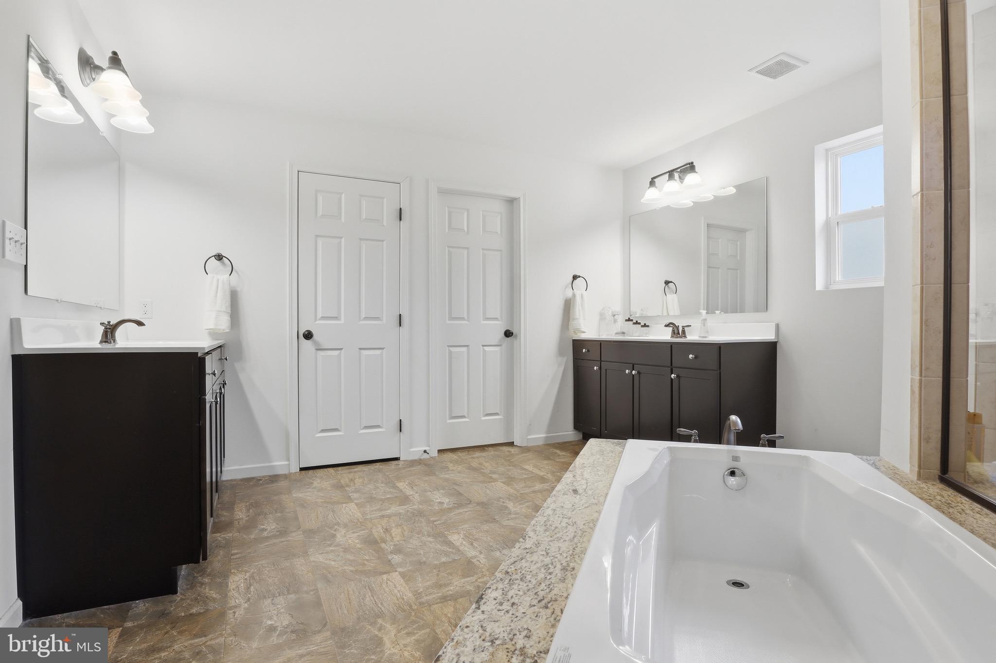 215 Azalea Drive Windsor, PA 17366 - Photo 38 of 68 a bathroom with a tub sink and mirror