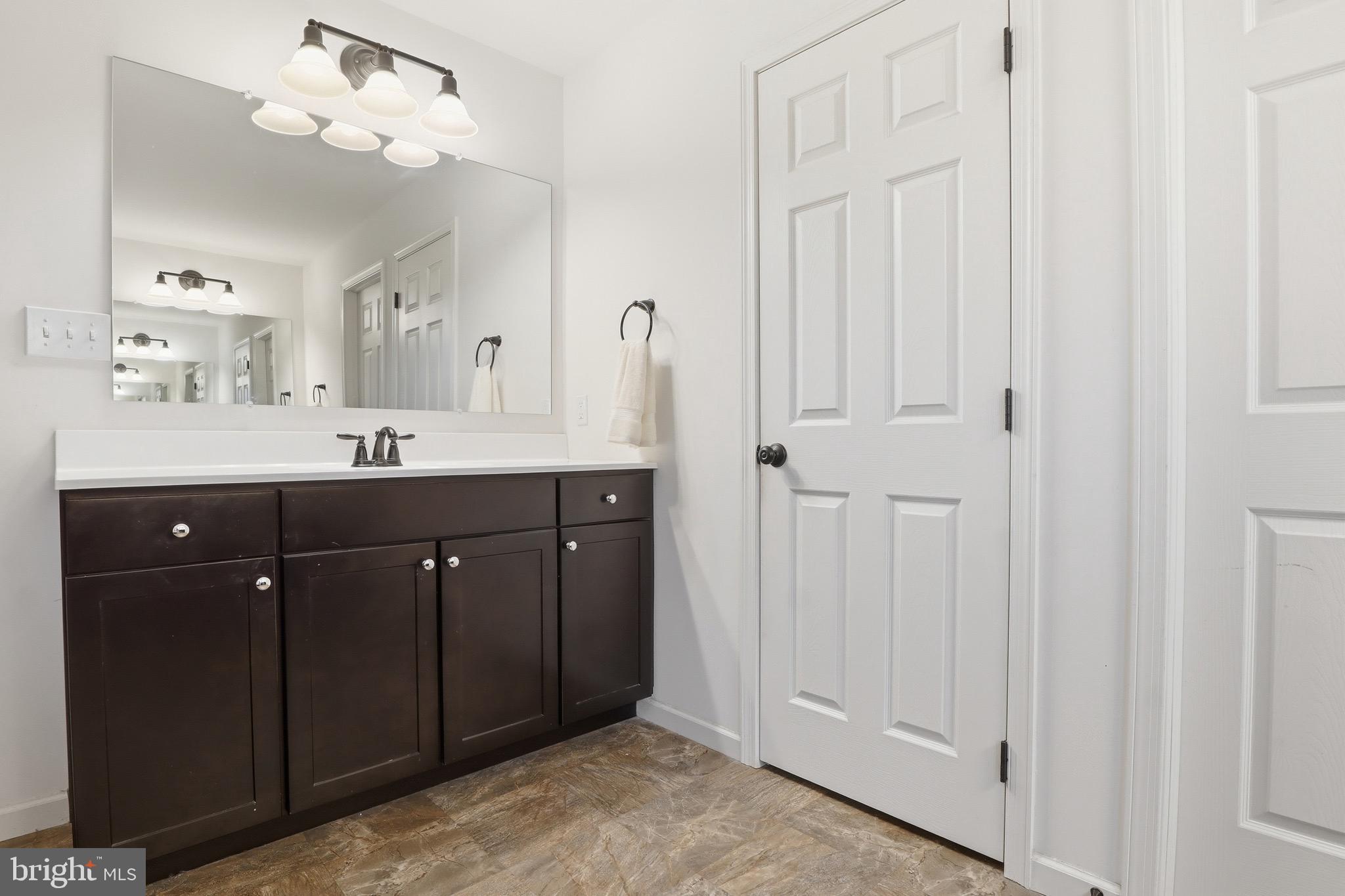 215 Azalea Drive Windsor, PA 17366 - Photo 39 of 68 a bathroom with a double vanity sink and mirror