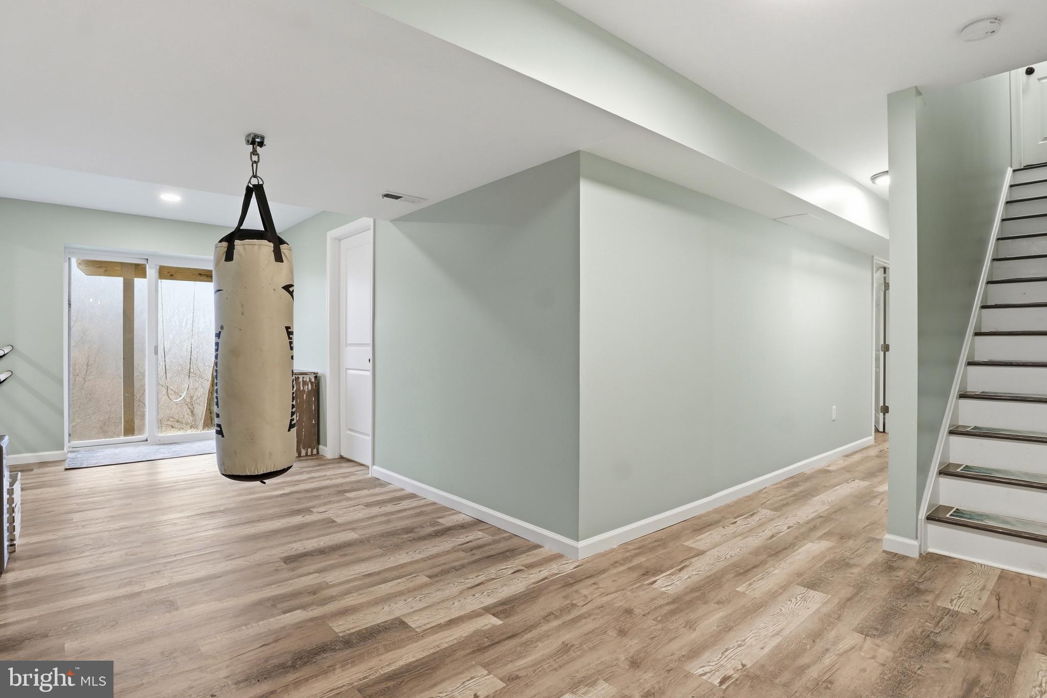 215 Azalea Drive Windsor, PA 17366 - Photo 41 of 68 a view of an empty room with wooden floor and windows