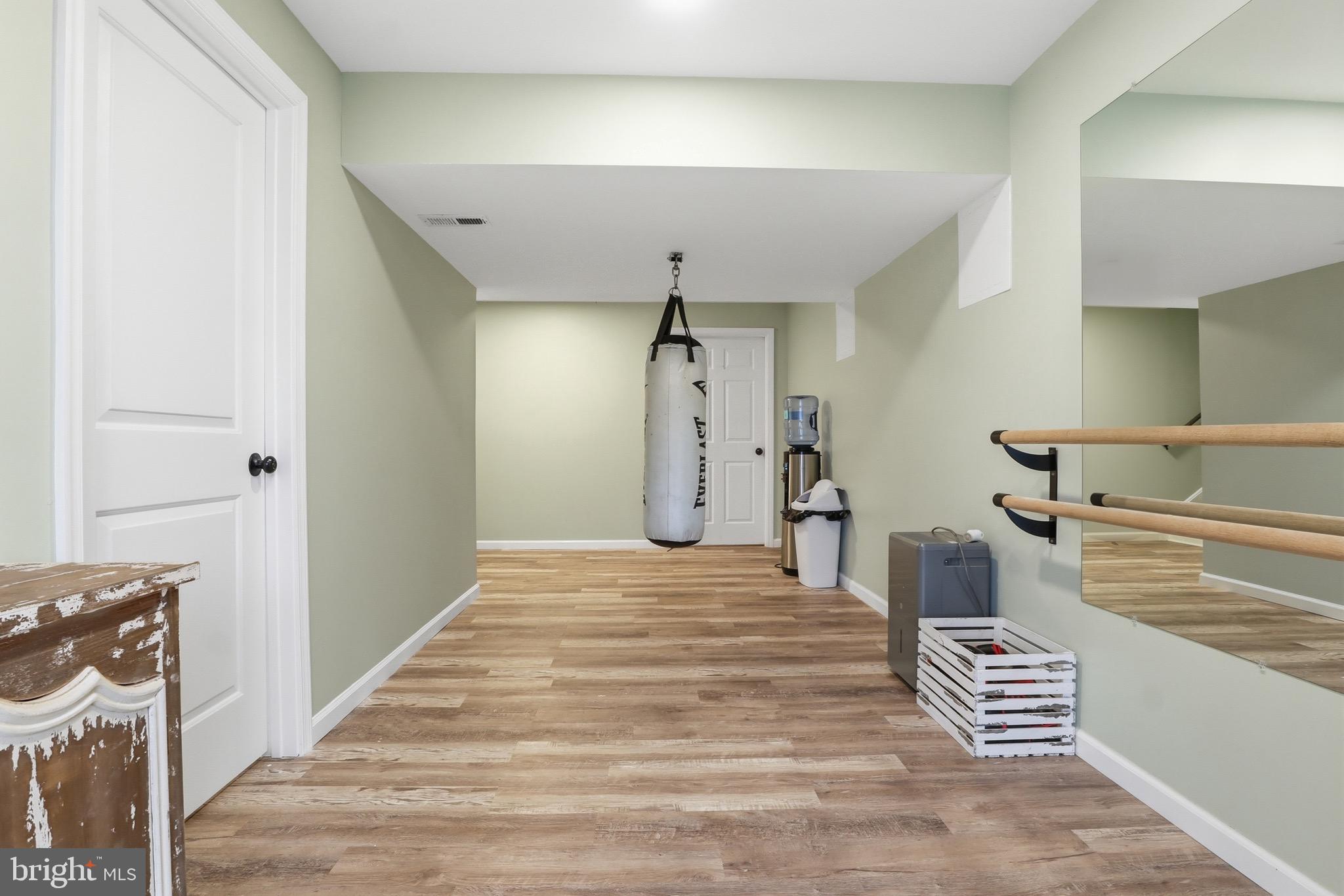 215 Azalea Drive Windsor, PA 17366 - Photo 42 of 68 a view of a hallway with stairs and wooden floor