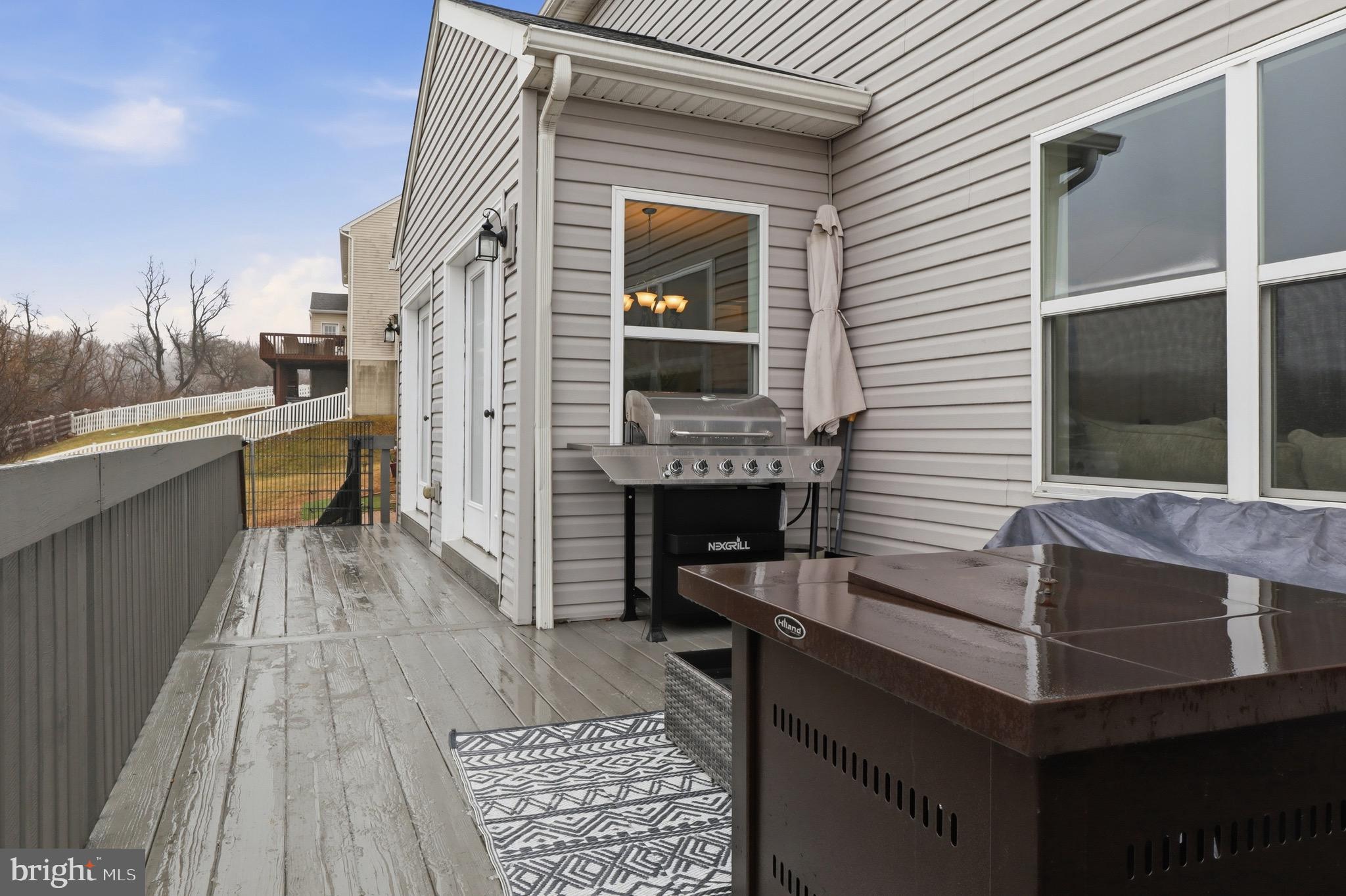 215 Azalea Drive Windsor, PA 17366 - Photo 52 of 68 a balcony with furniture and a fireplace