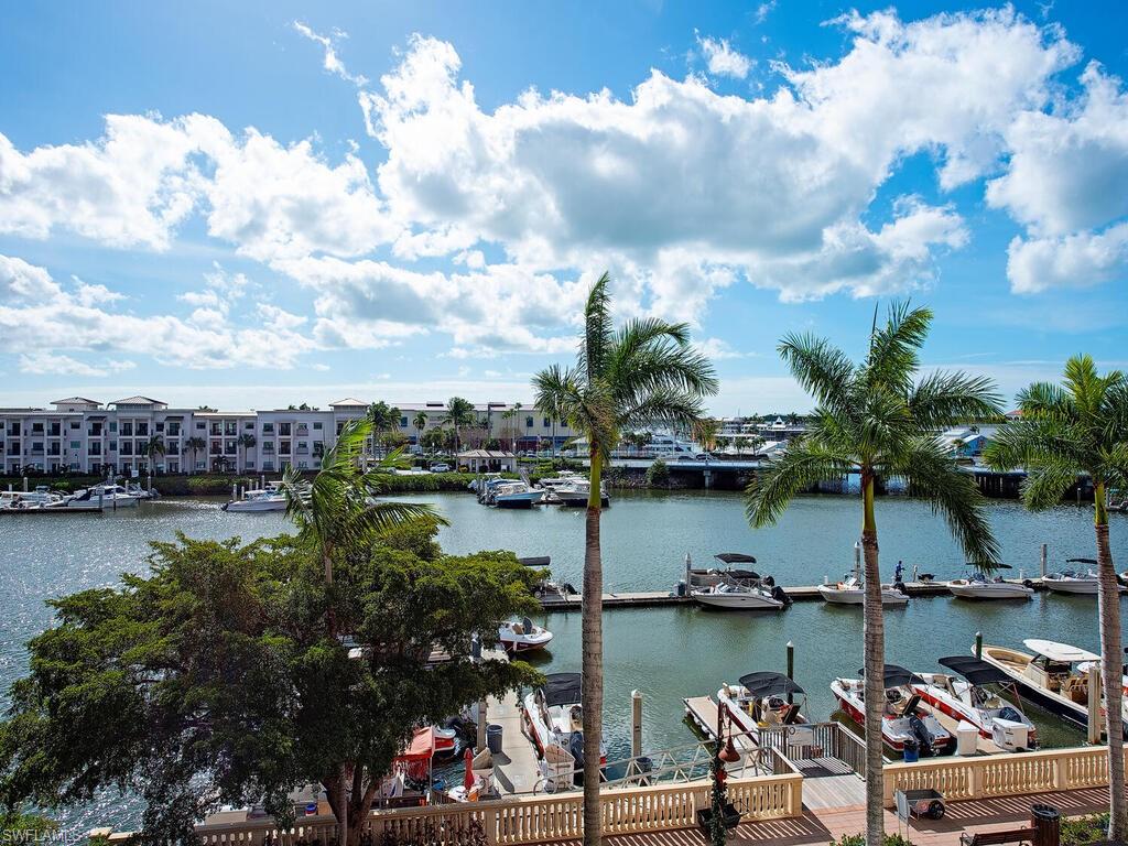 451 Bayfront Place, Unit 5311 Naples, FL 34102 - Photo 12 of 22 a view of a lake with boats and trees