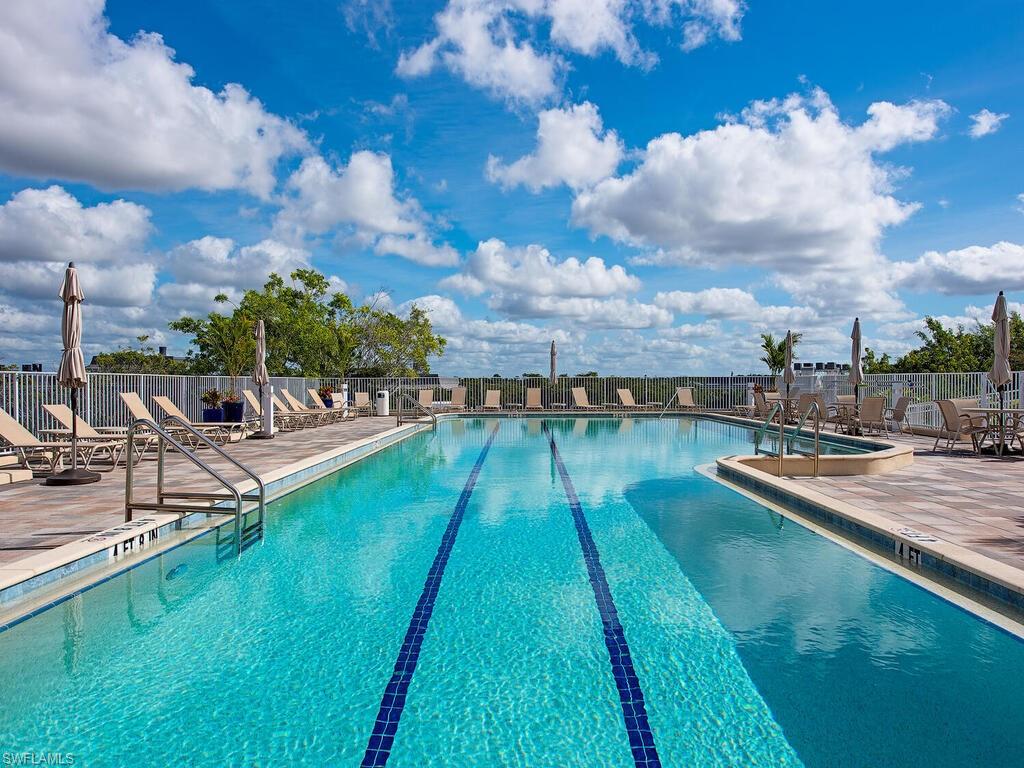 451 Bayfront Place, Unit 5311 Naples, FL 34102 - Photo 14 of 22 a view of swimming pool with a garden