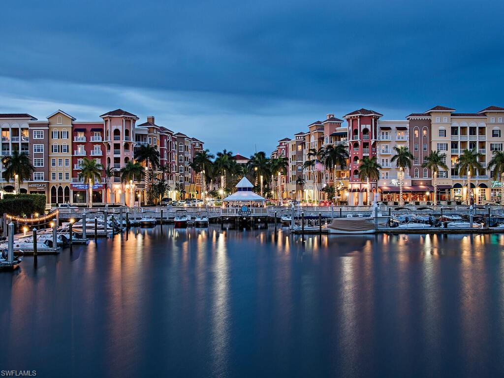 451 Bayfront Place, Unit 5311 Naples, FL 34102 - Photo 18 of 22 a view of a swimming pool and lounge chair