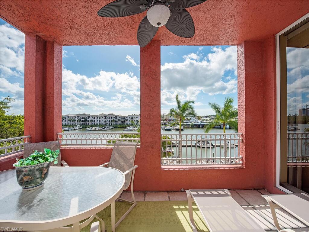 451 Bayfront Place, Unit 5311 Naples, FL 34102 - Photo 2 of 22 a dining room with a table and chairs