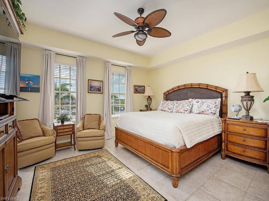 451 Bayfront Place, Unit 5311 Naples, FL 34102 - Photo 7 of 22 a bedroom with a bed couch and window