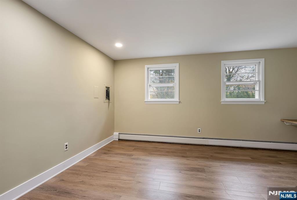 415 Goffle Road Wyckoff, NJ 07481 - Photo 22 of 30 a view of a room with wooden floor and window