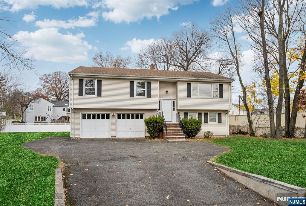 415 Goffle Road Wyckoff, NJ 07481 - Photo 30 of 30 a front view of a house with a yard