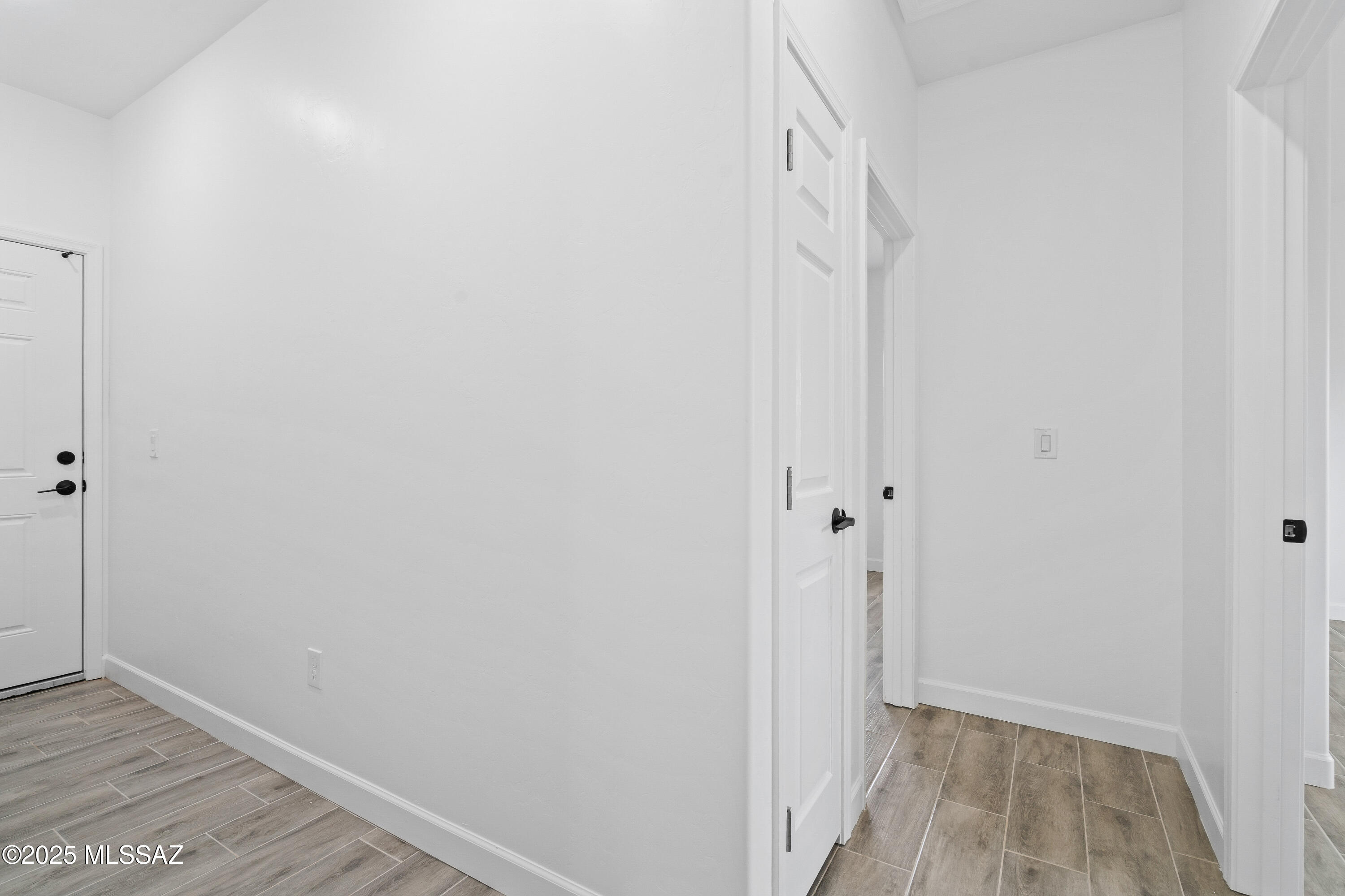1851 Calle Salmon Rio Rico, AZ 85648 - Photo 28 of 29 a view of a hallway with wooden floor and closet