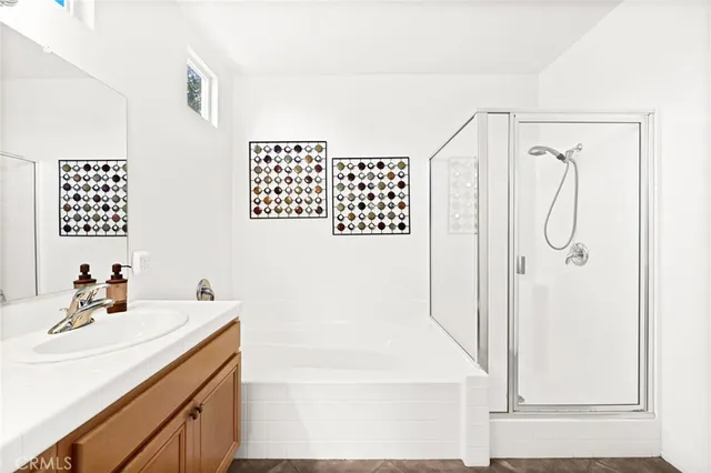 a bathroom with a sink double vanity and a bathtub