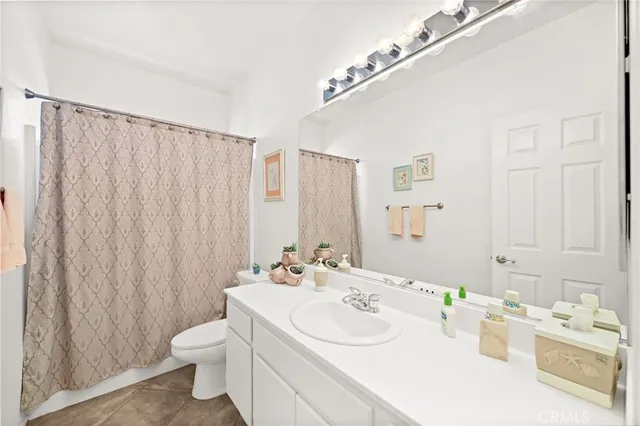 a bedroom with a bed and a table in it