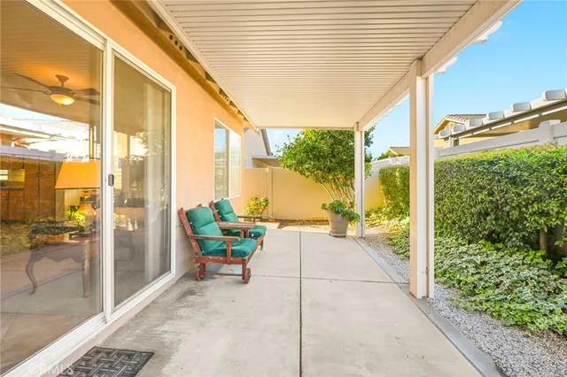 a view of a balcony with wooden floor and front door