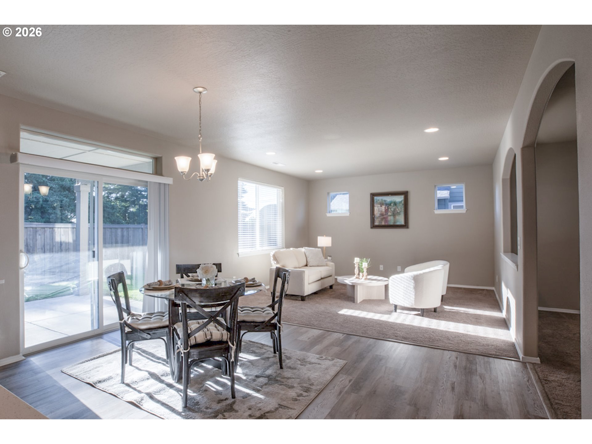2952 Shelby Way Eugene, OR 97404 - Photo 3 of 25 a view of a dining room with furniture and wooden floor