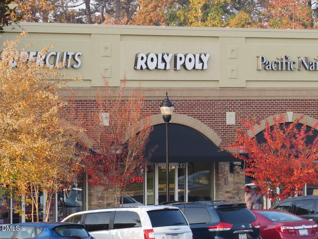 2636 Asher View Court Raleigh, NC 27606 - Photo 34 of 35 a front view of a building with parking and sign board