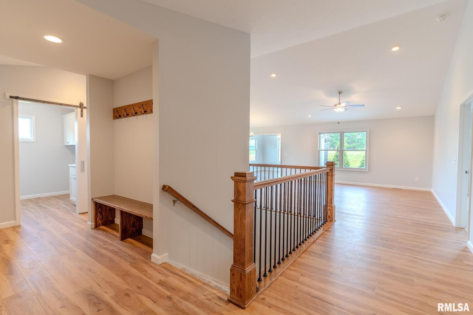 941 9th Avenue North Clinton, IA 52732 - Photo 2 of 24 a view of a hallway with wooden floor and windows