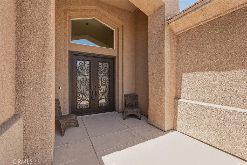 9 Orleans Road Rancho Mirage, CA 92270 - Photo 8 of 71 a view of a entryway door of the house
