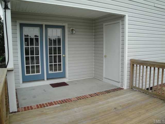 4913 Windsprint Way Raleigh, NC 27616 - Photo 4 of 5 an empty room with wooden floor