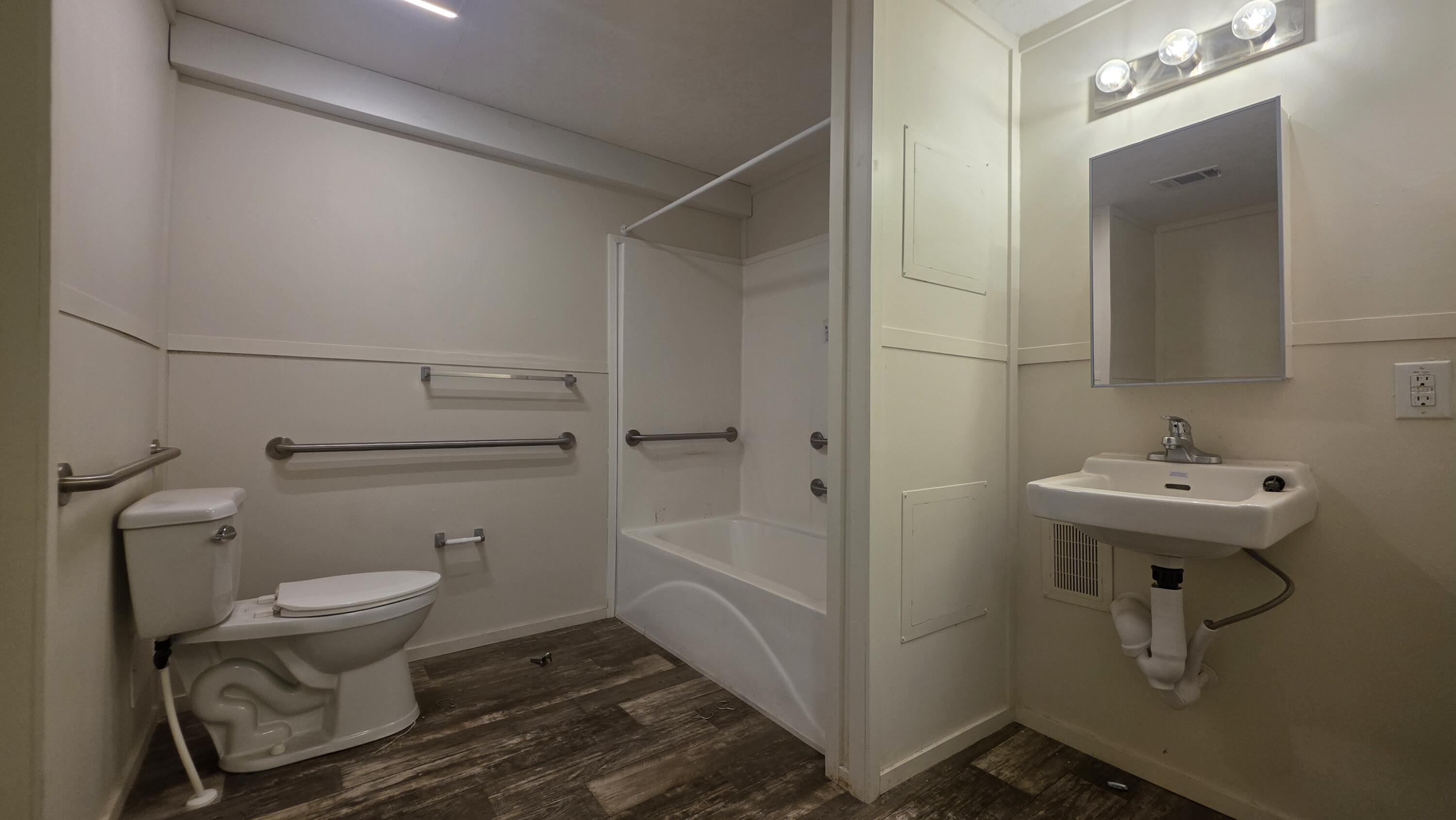 6801 19th Street, Unit 179 Lubbock, TX 79407 - Photo 11 of 15 a bathroom with a sink toilet and shower