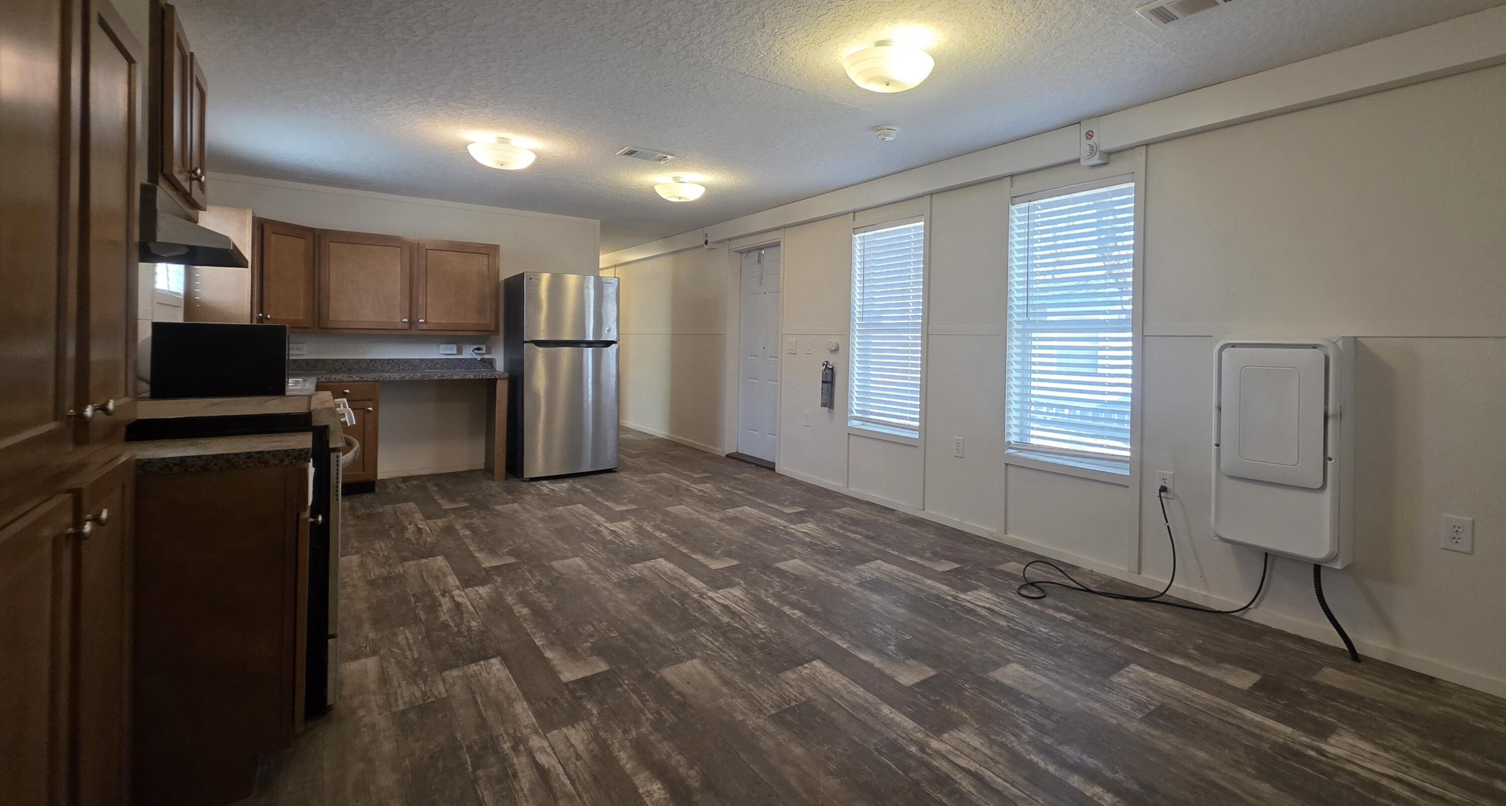 6801 19th Street, Unit 179 Lubbock, TX 79407 - Photo 2 of 15 a view of a kitchen with refrigerator and window