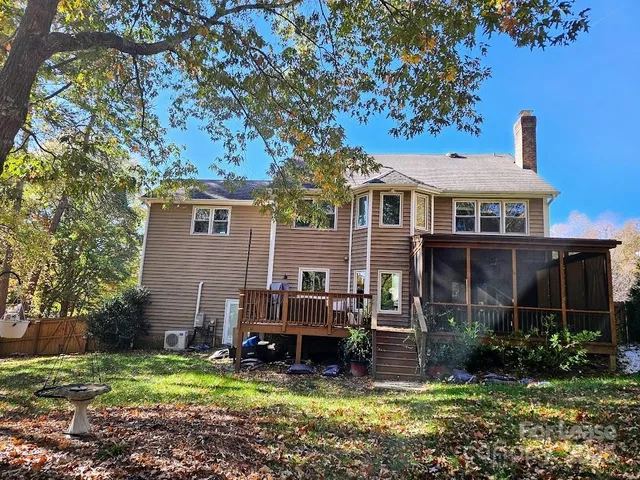 a view of a house with a yard porch and sitting area