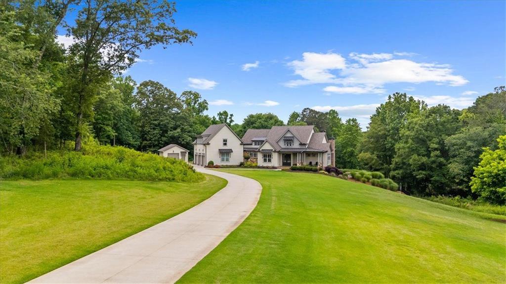 2503 Sugar Pike Road Canton, GA 30115 - Photo 9 of 134 a view of a house with a big yard