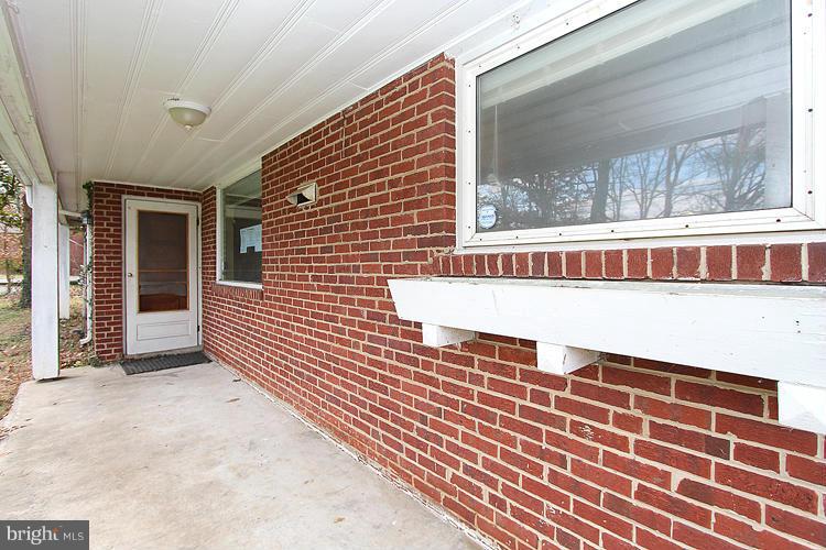 10510 Rodney Road Silver Spring, MD 20903 - Photo 4 of 30 a view of a balcony with wooden floor and a potted plant