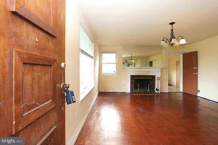 10510 Rodney Road Silver Spring, MD 20903 - Photo 5 of 30 a view of a livingroom with a fireplace and window