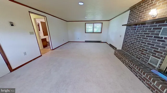 a bathroom with a granite countertop toilet and a sink