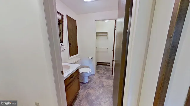 a bathroom with sink a mirror and shower