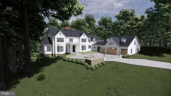 a front view of a house with a garden and trees