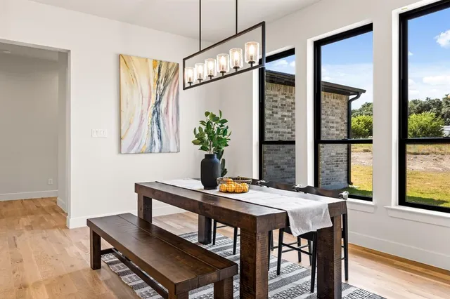 a dining room with furniture and window