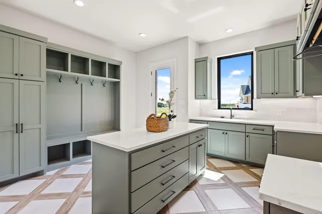 a kitchen with a sink and refrigerator