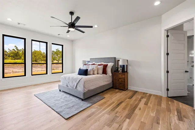 a bedroom with a large bed and a window