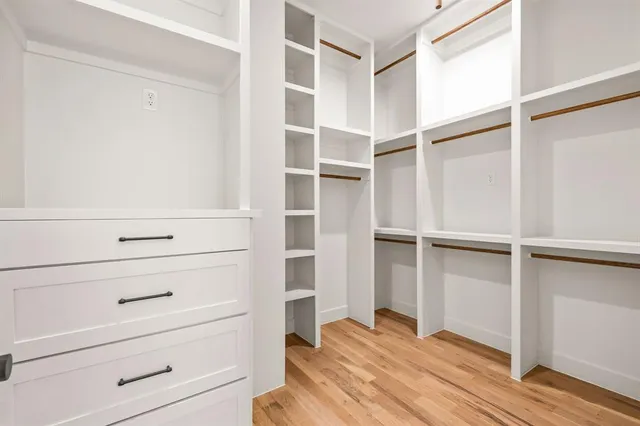 a view of an empty walk in closet