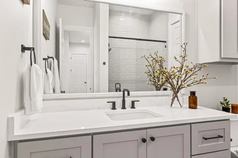 a bathroom with a sink and mirror