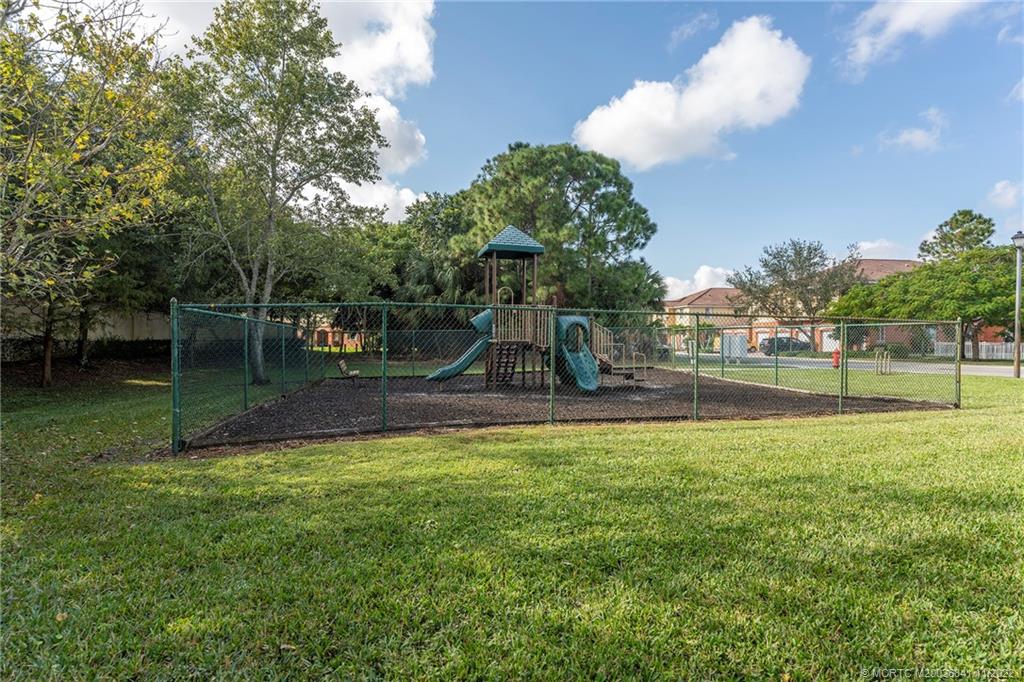 61 Southeast Palermo, Unit 202 Stuart, FL 34994 - Photo 5 of 10 a view of a garden with a slide
