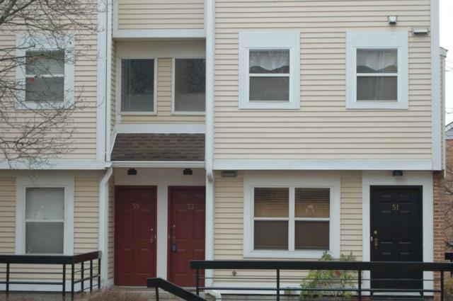 53 Highland Road, Unit 53 Stamford, CT 06902 - Photo 1 of 1 a view of a house with a window and brick walls