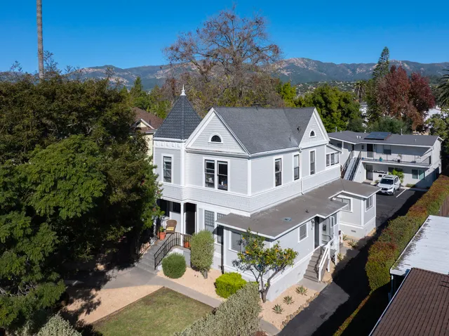 a aerial view of a house with a yard
