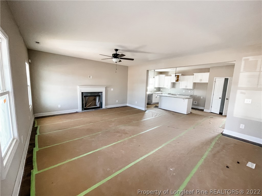185 Winnsboro (lt113) Road Raeford, NC 28376 - Photo 2 of 19 a view of living room with furniture and a fireplace