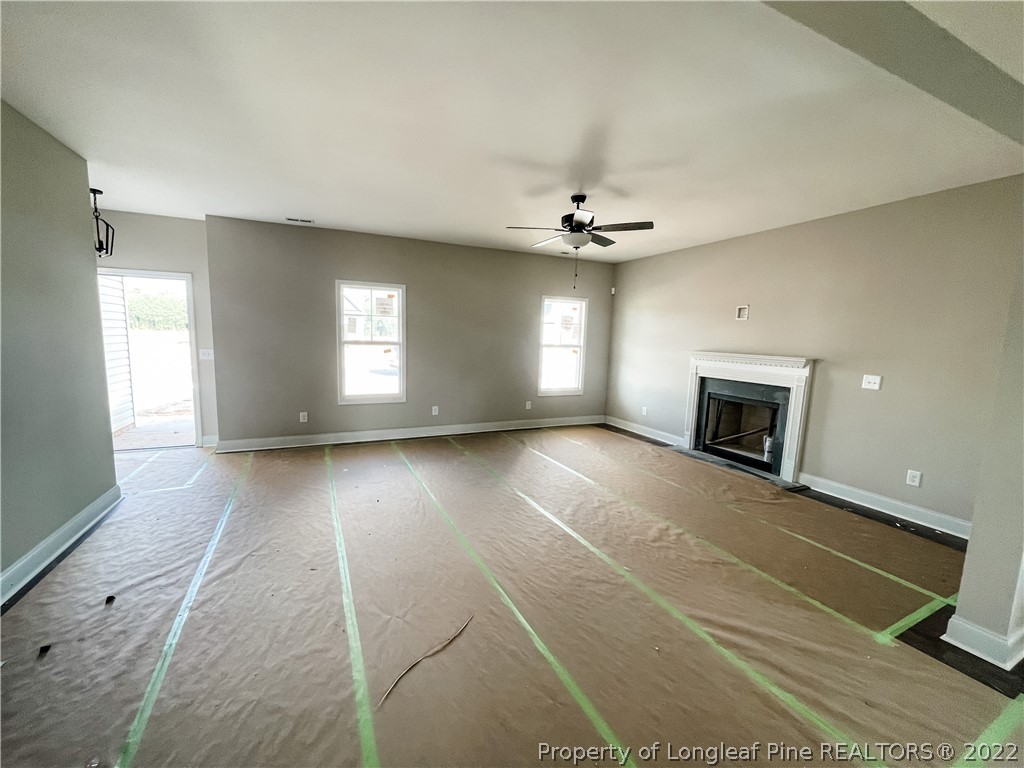 185 Winnsboro (lt113) Road Raeford, NC 28376 - Photo 3 of 19 a view of an empty room with a fireplace and a window