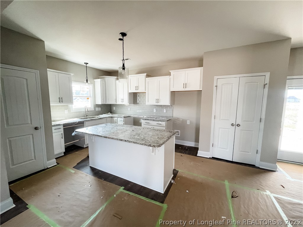185 Winnsboro (lt113) Road Raeford, NC 28376 - Photo 5 of 19 a kitchen with stainless steel appliances granite countertop a sink and a refrigerator
